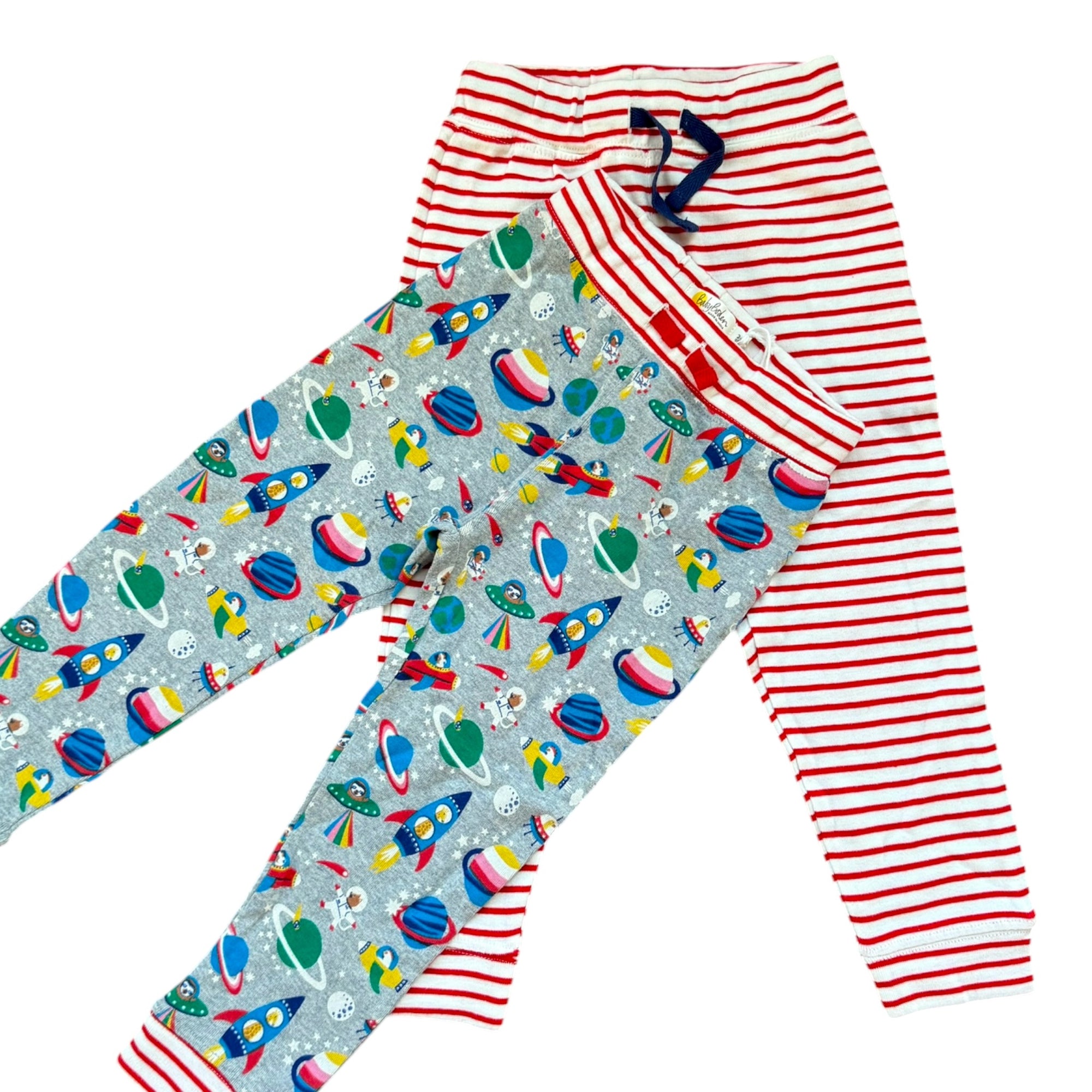 Children's leggings with space-themed design and red and white striped pattern on a white background